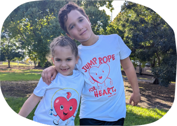 A young boy and girl standing in a park, wearing the new Jump Rope for Heart t-shirts A young boy and girl standing in a park, wearing the new Jump Rope for Heart t-shirts