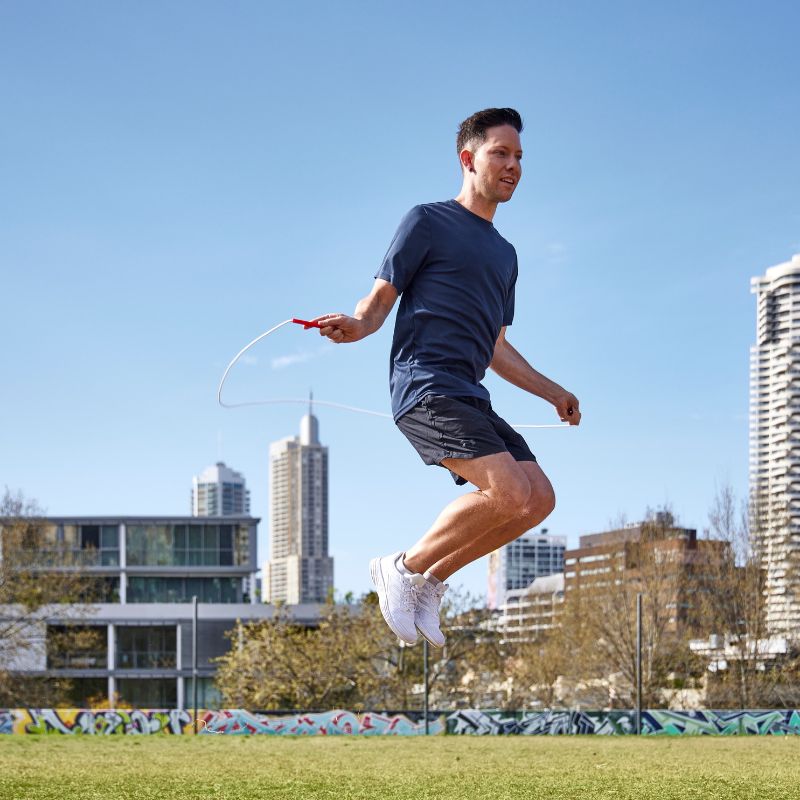 Luke Boon jumping a skipping rope in the park