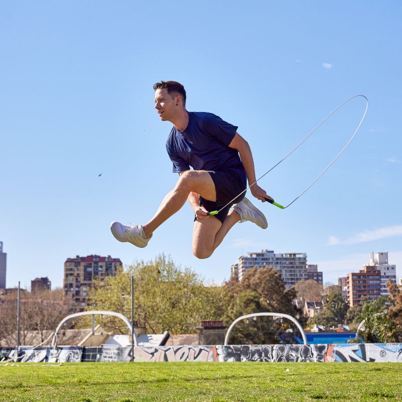 Luke Boon jumping a skipping rope in the park