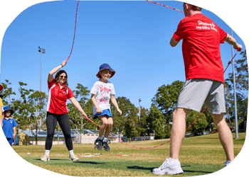 Grace, a Jump Rope for Heart Field Officer, running a skipping session at a primary school